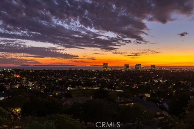 Sunset outlook from Harbor Ridge, Pacific Ocean, Newport Harbor and city lights beyond 15 & 17 La Rochelle